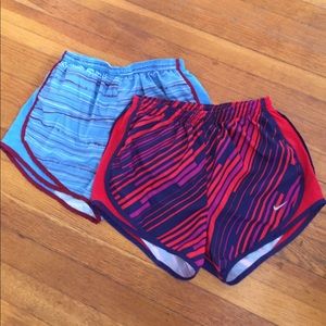 Two pairs of size small Nike tempo shorts
