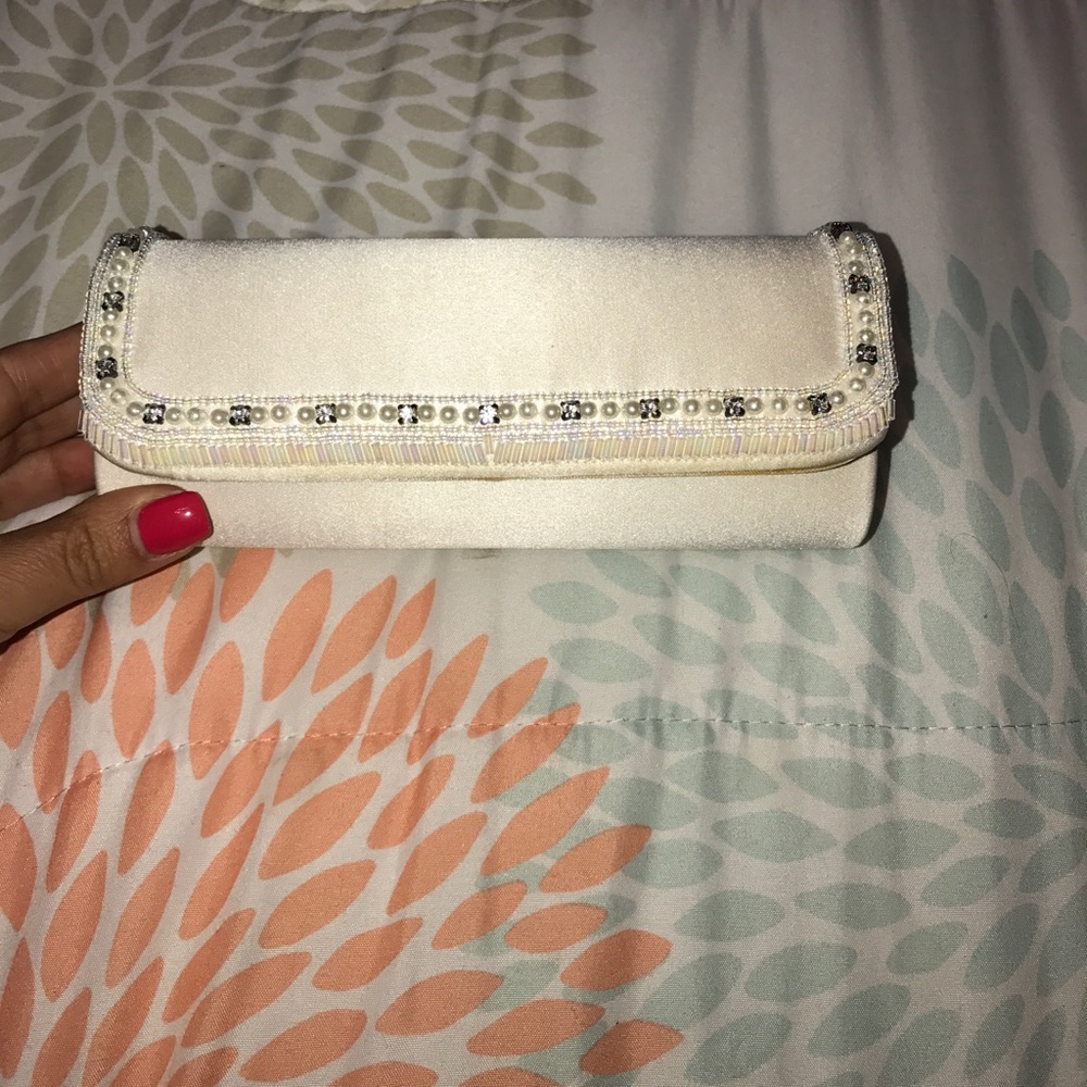 White satin clutch, a few unnoticeable flaws $10