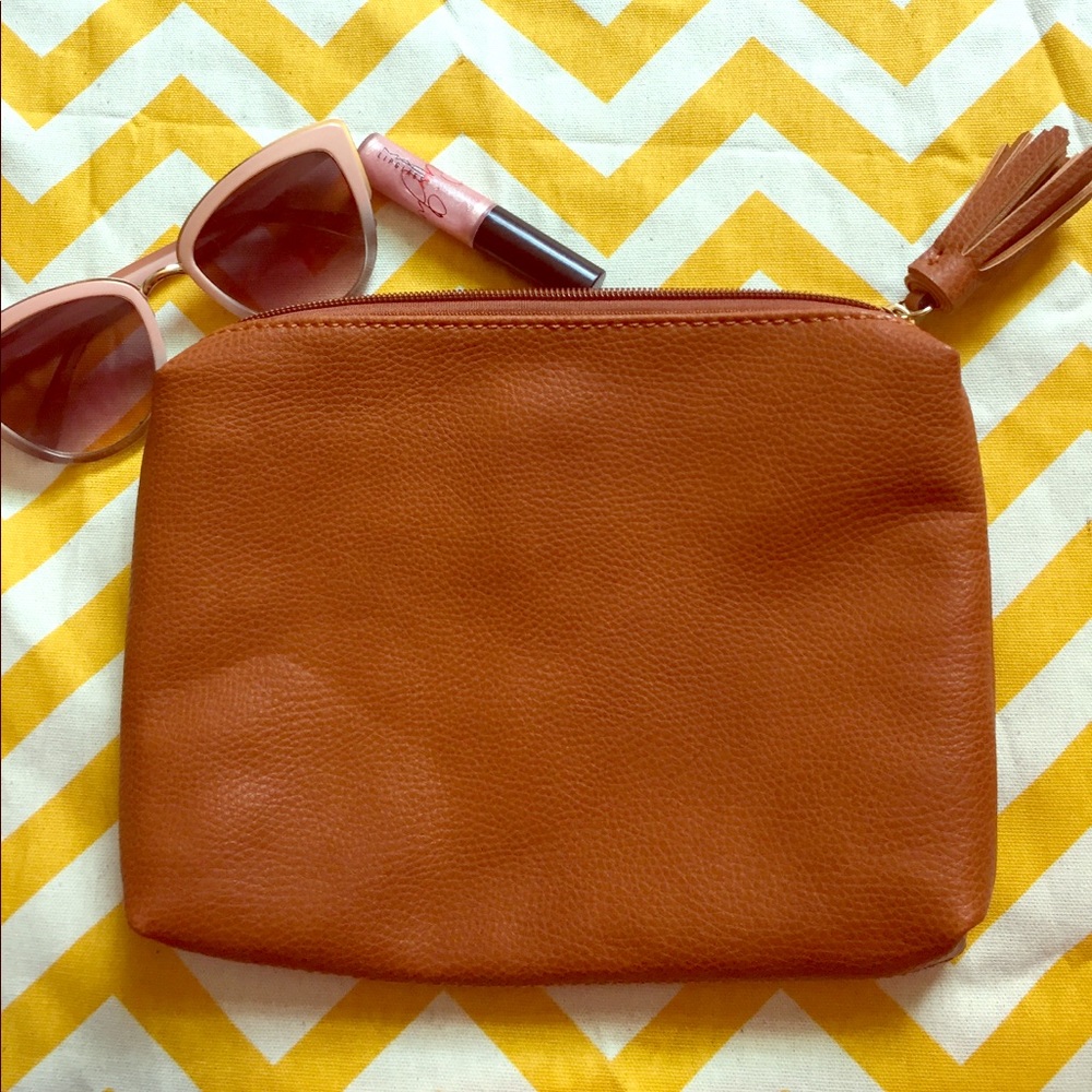 Brown tassel clutch