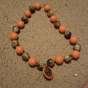 Orange and camouflage beaded necklace.