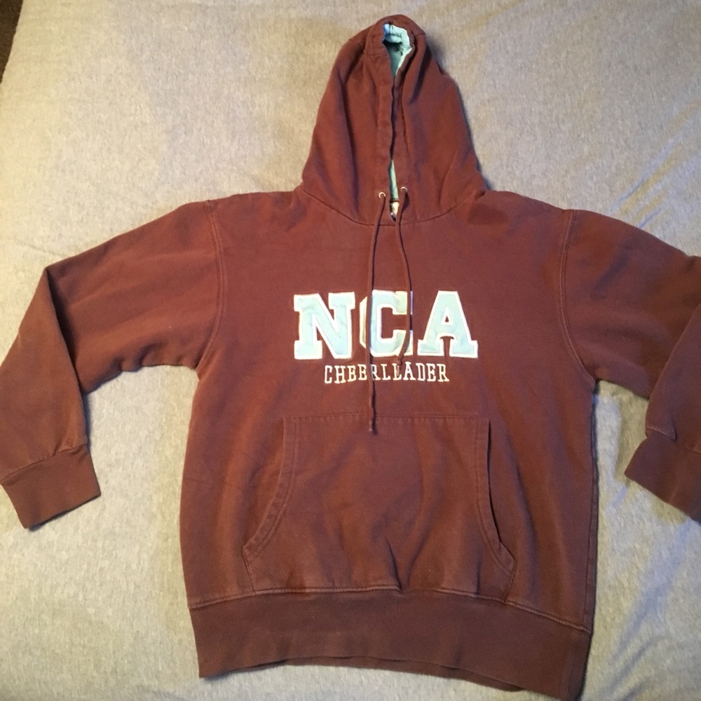 NCA cheerleading sweatshirt. Brown. Size youth L