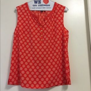 Orange print sleeveless blouse