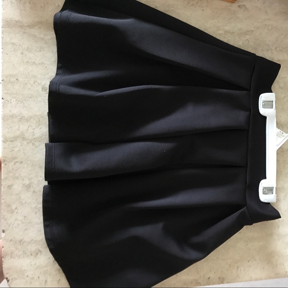 black pleated skater skirt