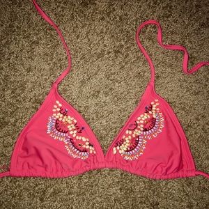 Pink bikini top with fun design