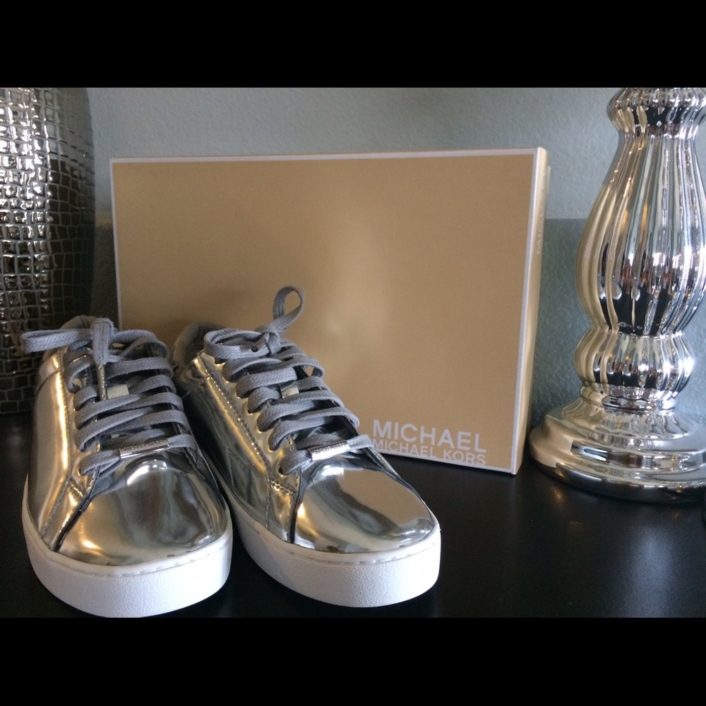 New Michael Kors silver sneakers.