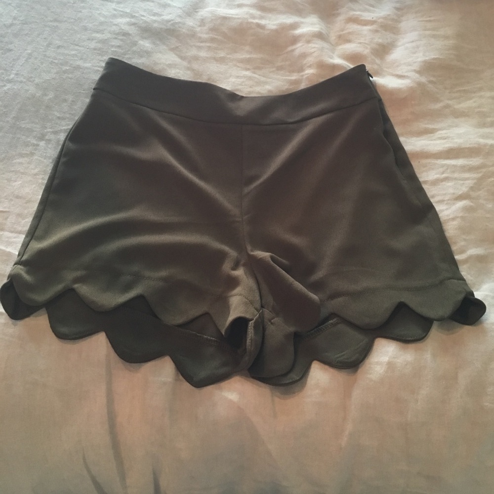 Olive green scalloped shorts.