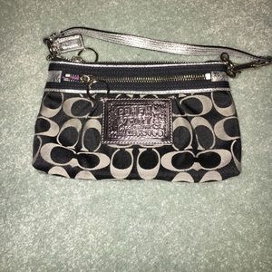 Black and silver coach wristlet