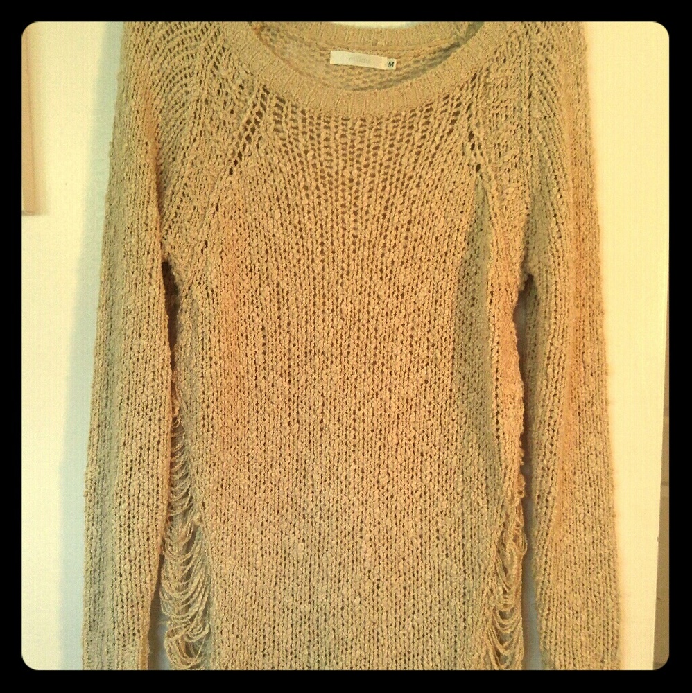 Unique torn sweater