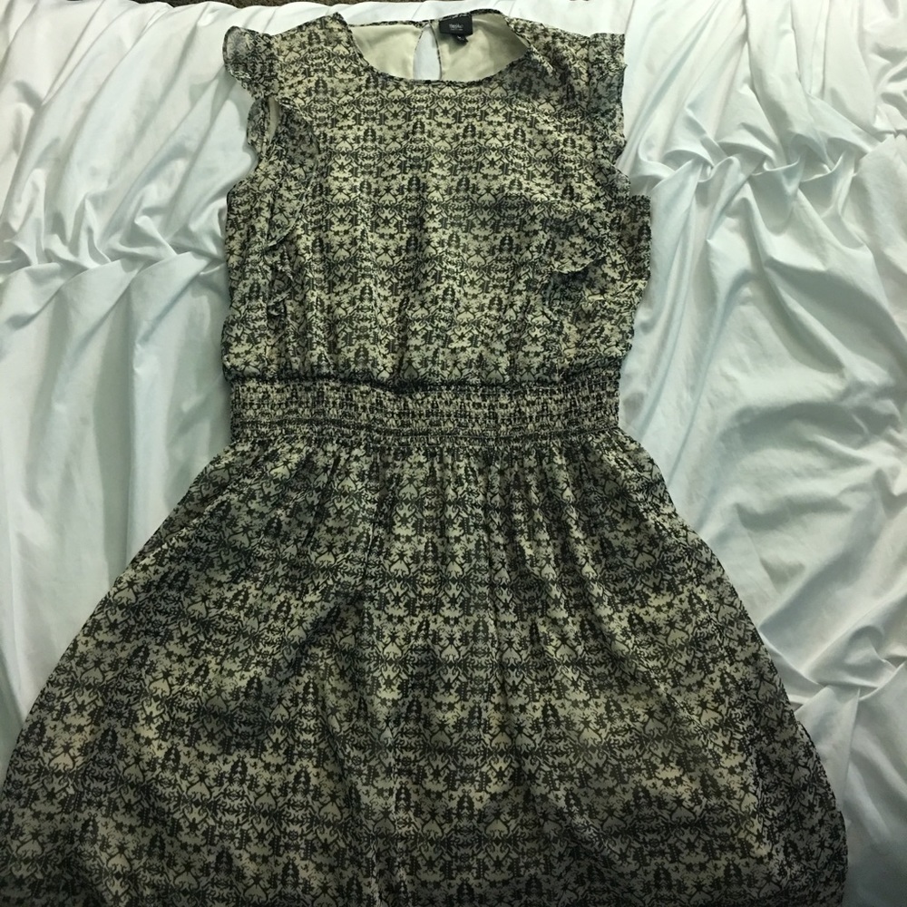 Green and cream colored dress