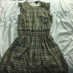 Green and cream colored dress