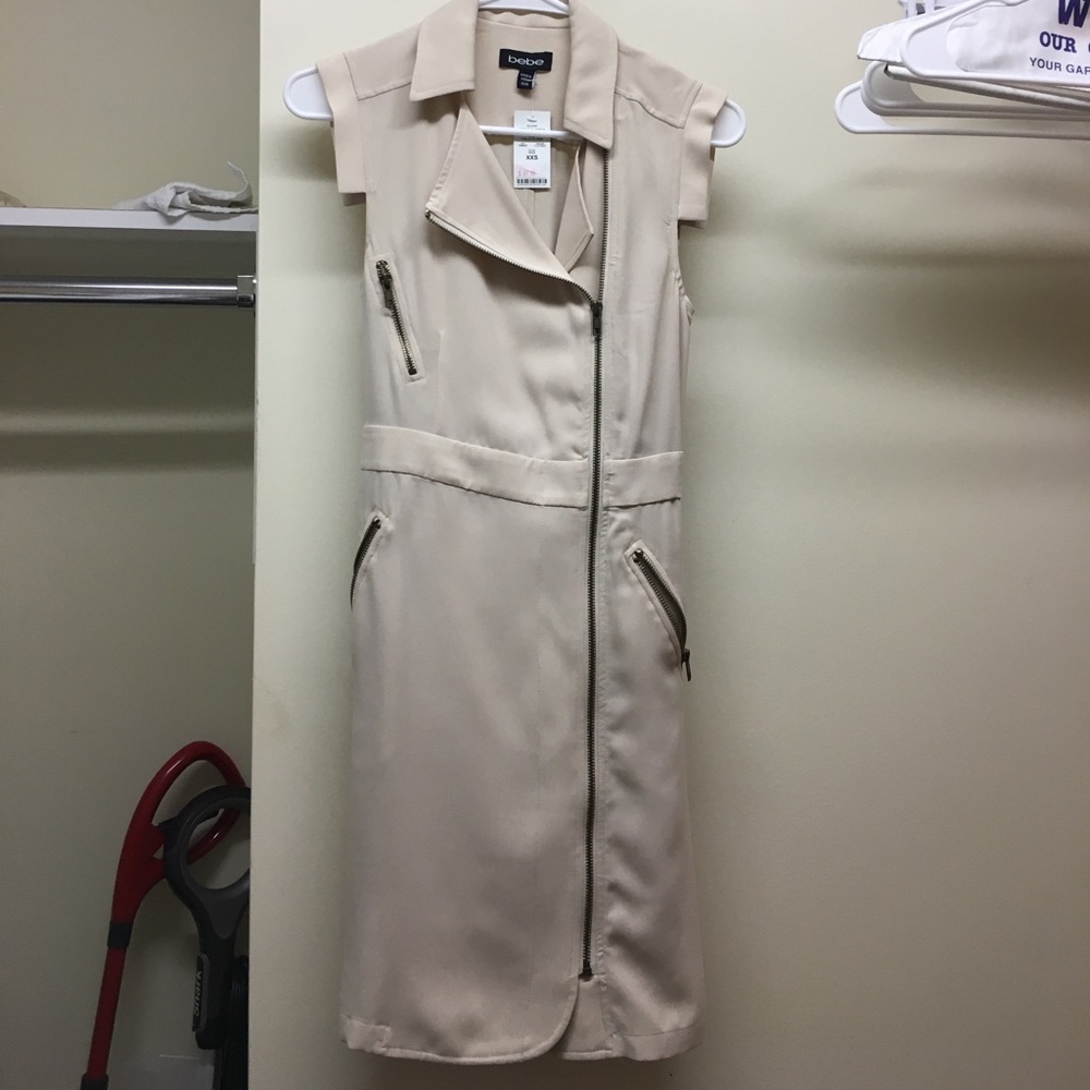 Brand new. Never wear. Bebe shirt dress.
