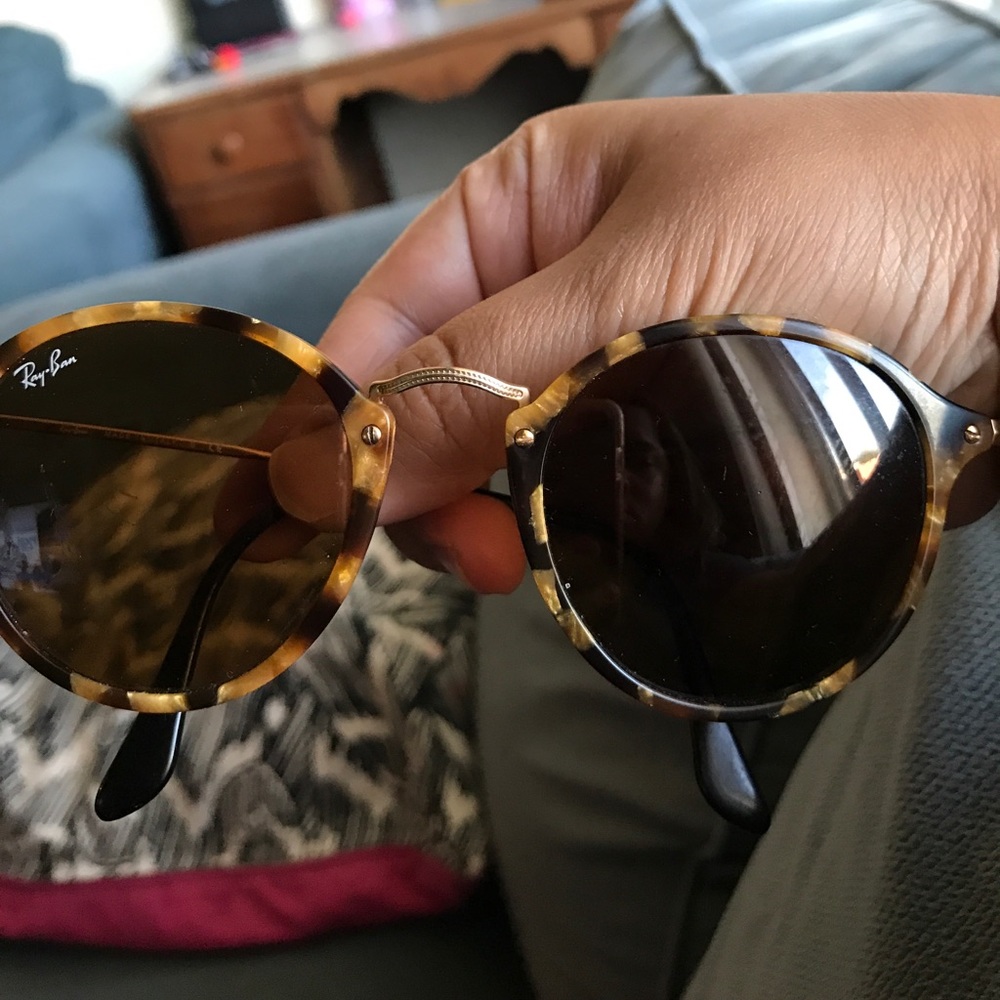 Pair of used ray ban round fleck glasses.