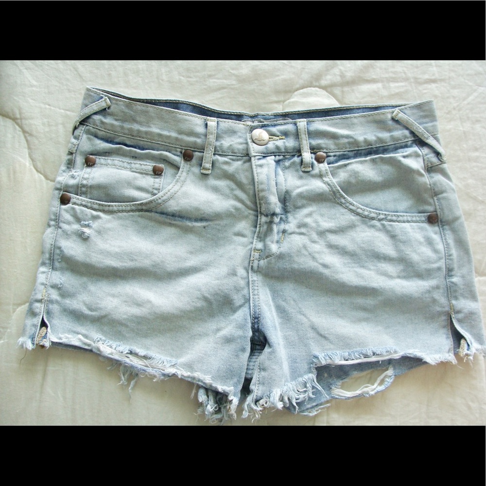 Free people light wash denim cut off shorts
