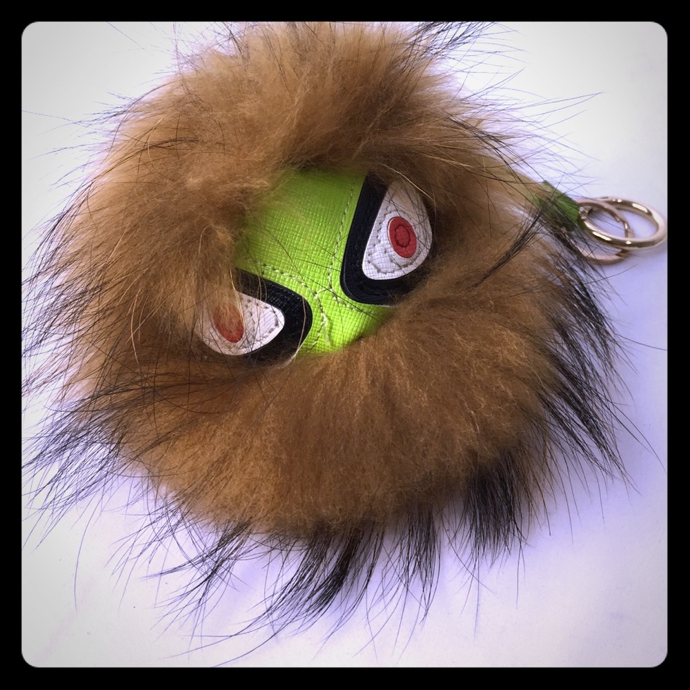 raccoon and leather pom-pom keychain