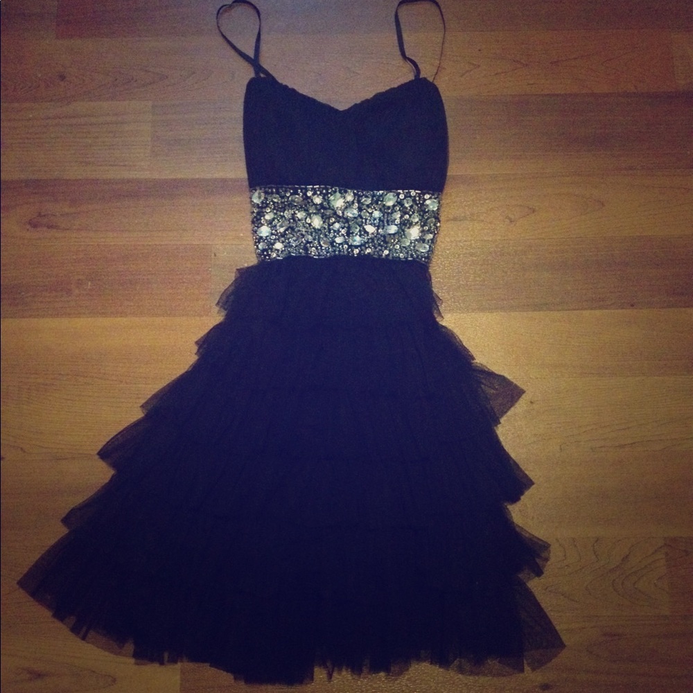 Dark black fluffed dress with gems at the waist