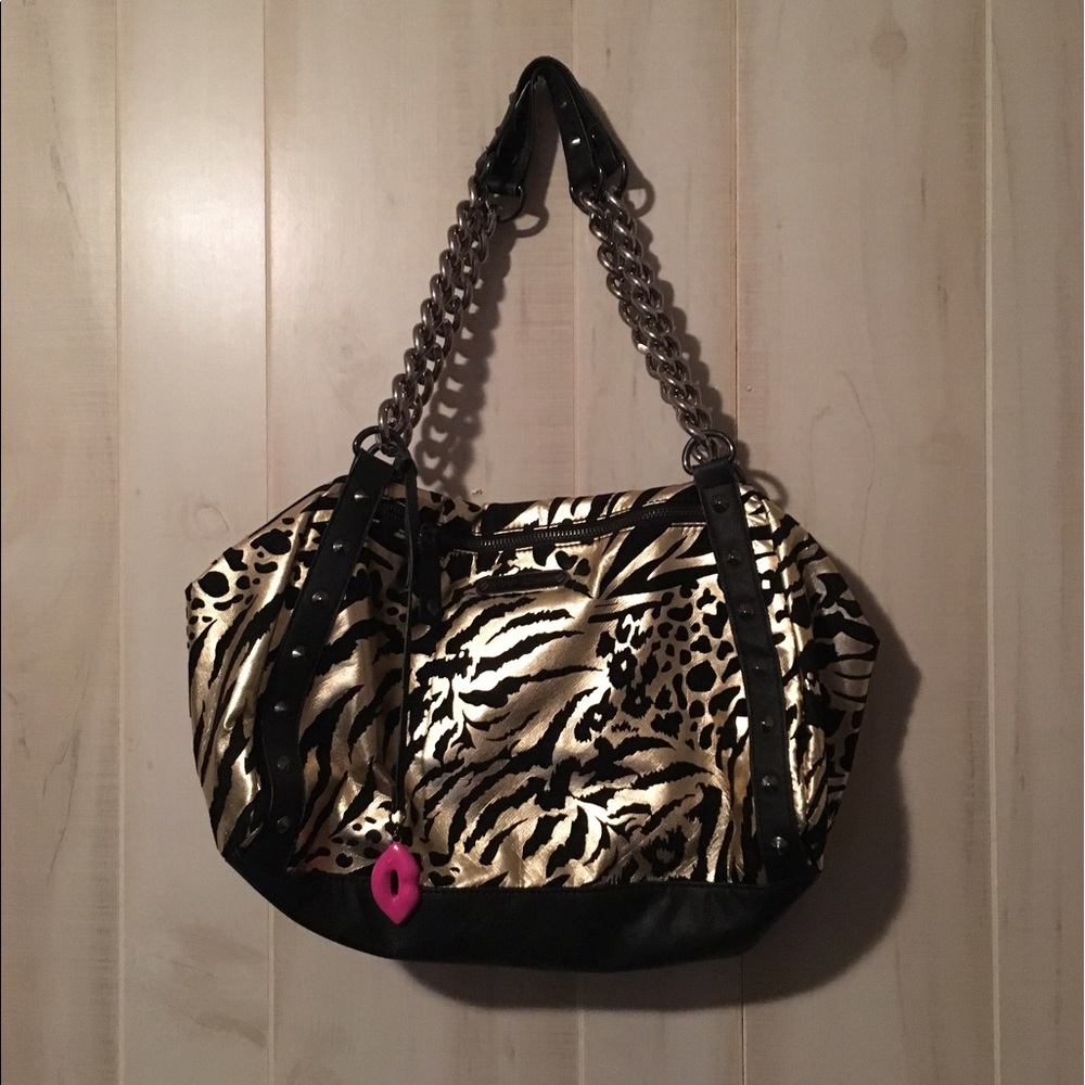 Like new Betsey Johnson gold and black print purse