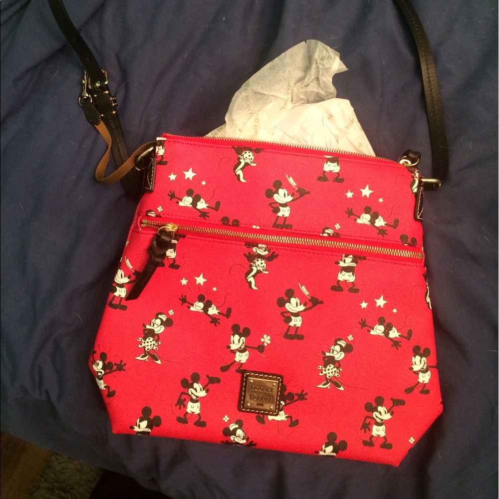 Disney Dooney crossbody. NWOT. Never used.
