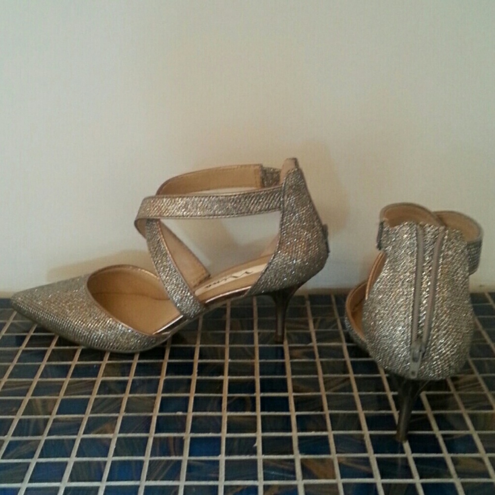 Dance all night in silver dress shoes. Worn 1x.