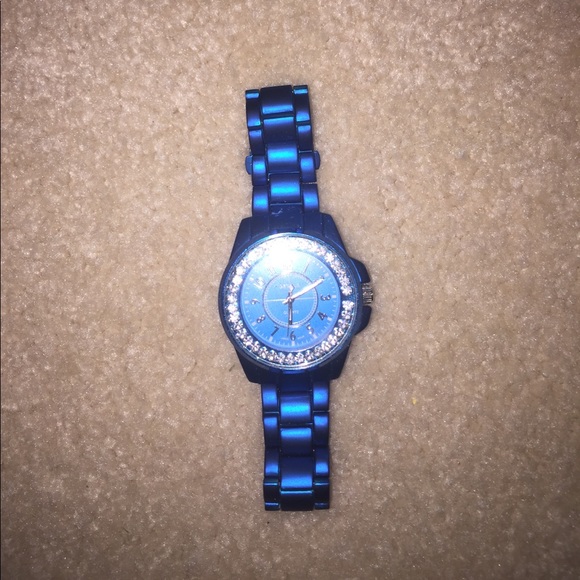 Blue stainless steel watch diamonds around face. - Picture 1 of 1