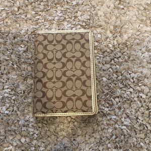 Coach passport holder.  Signature & metallic gold