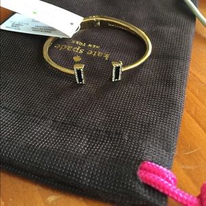 Gold kate spade bracelet with black embellishment