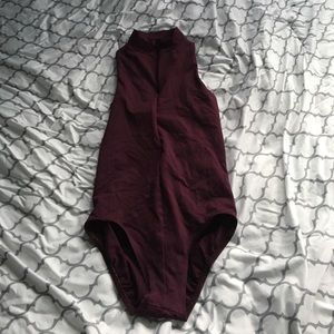 Dark purple high neck leotard and matching skirt