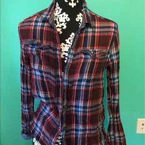 navy, orange, and maroon flannel