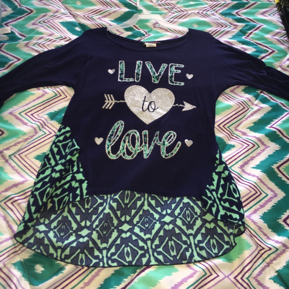 A dark blue & green "live to love" blouse