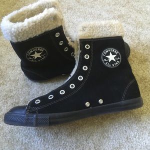 Fur lined black leather high top Chuck Taylors