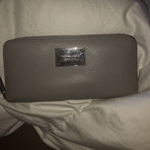Micheal Kors gray/silver wallet.