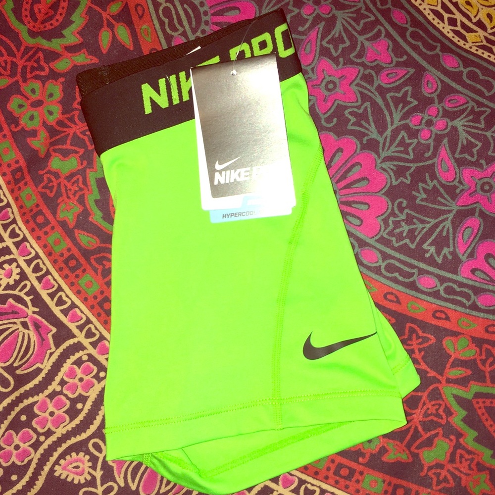 Brand-new Nike pros with tags attached neon green!