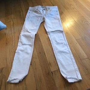 White skinny jeans with rip in knees