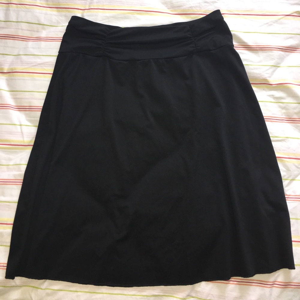 Knee to mid-calf length black skirt