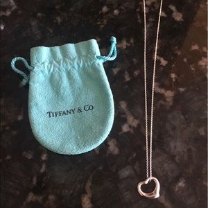 Tiffany & Co open heart pendant necklace.