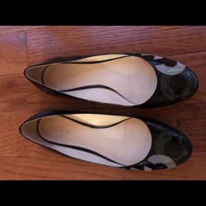 Coach black flats with the "C" on the front