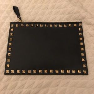 Gold studded clutch