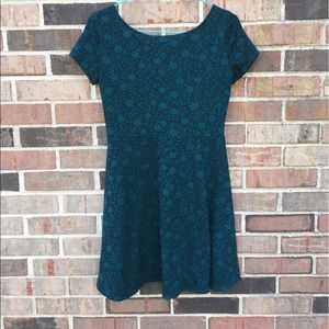 Skater dress with teal and  black floral pattern
