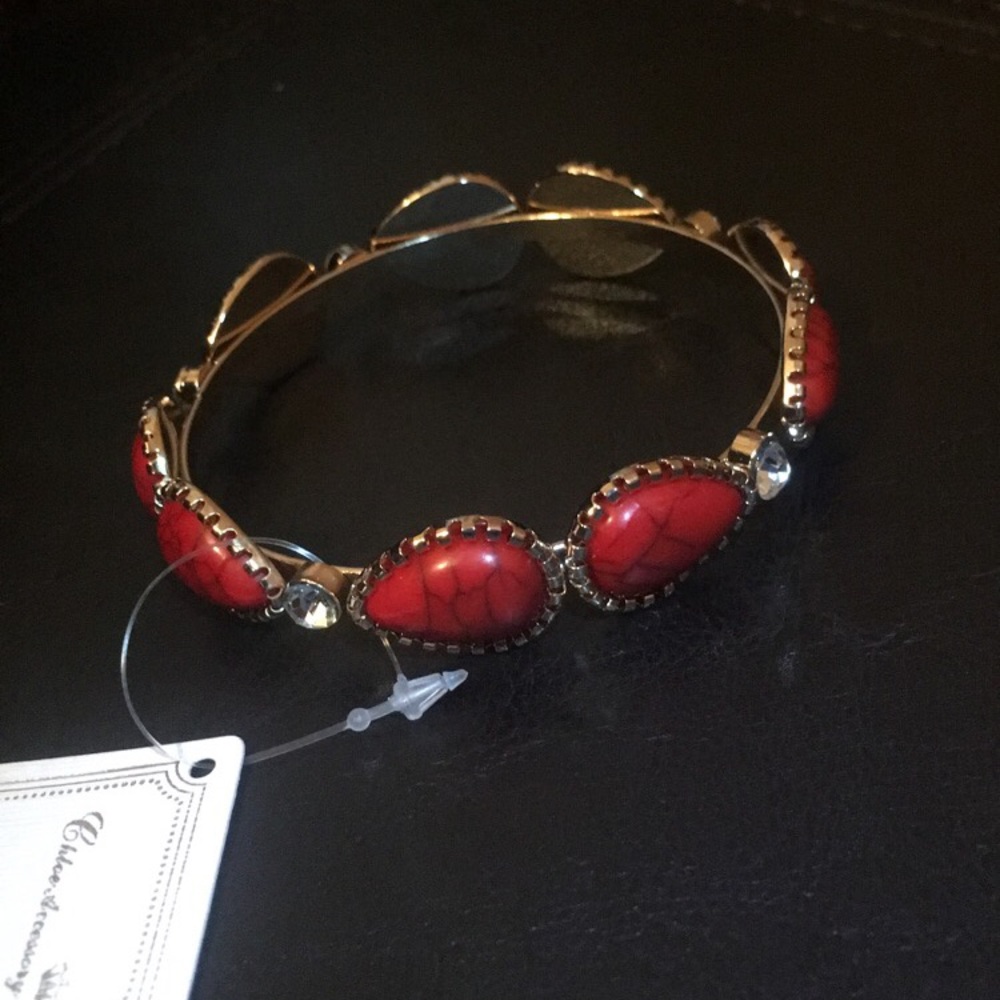 NWT Beautiful gold bracelet with red gems