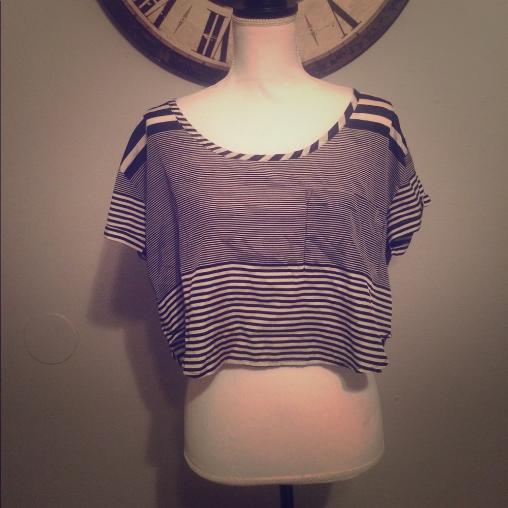 Black and white hi-lo crop top w/ cuffed sleeves.