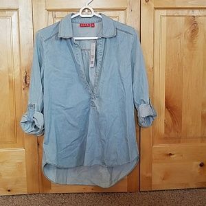 Long sleeve top with tags.