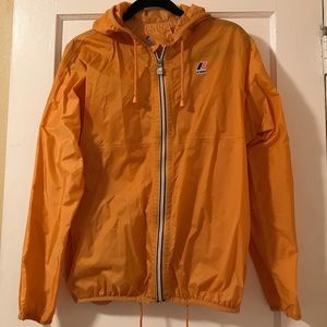 Rain/wind hooded jacket with adjustable waist.