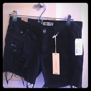 Distressed black jean shorts
