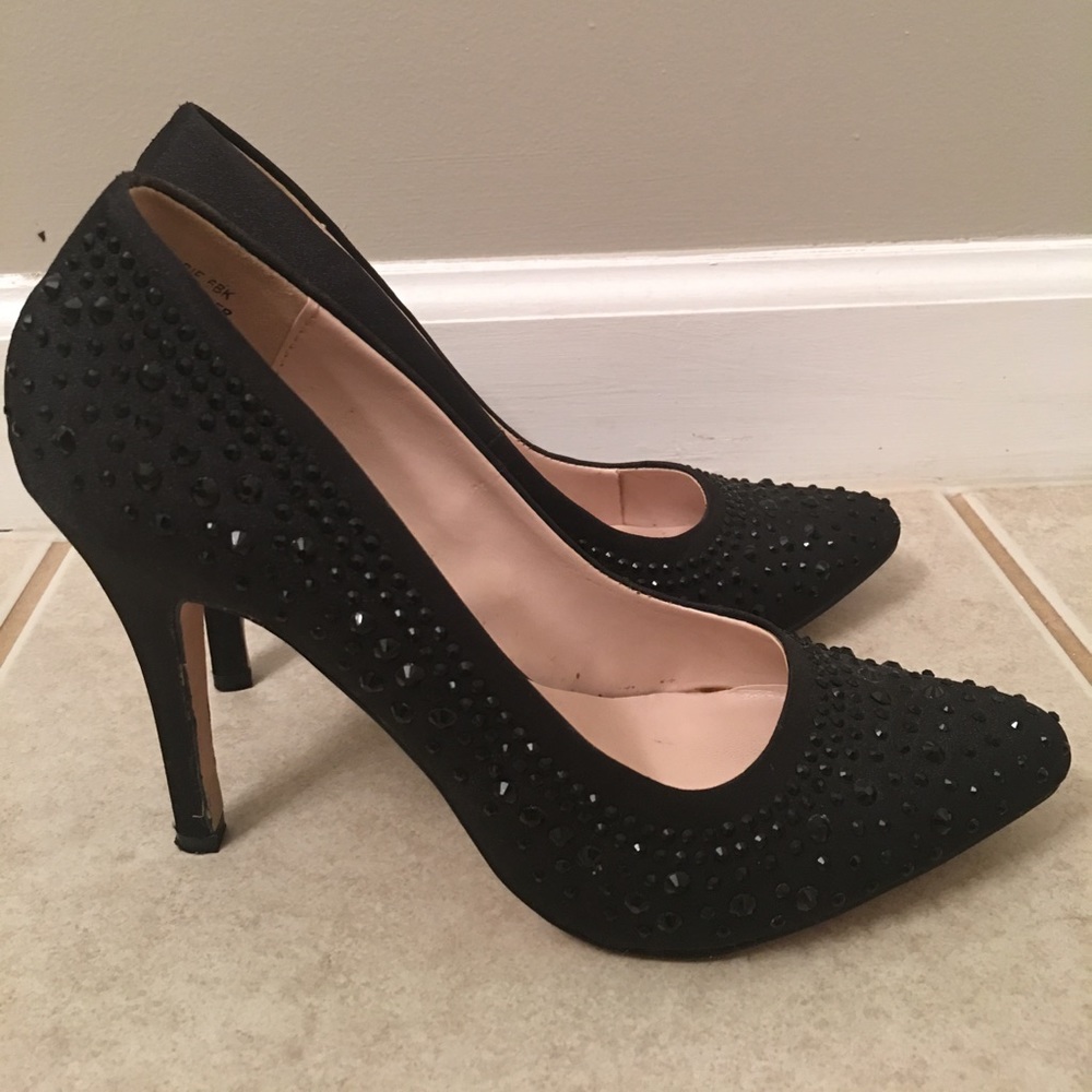 Pair of black, studded pump heels.