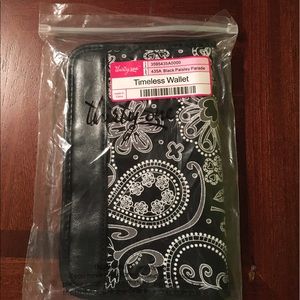 Black paisley parade wallet.