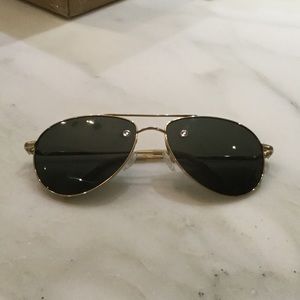 Oliver Peoples aviator style sunglasses.