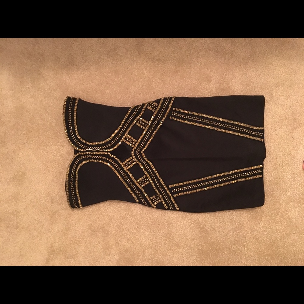 Bebe tight strapless dress with gold detailing