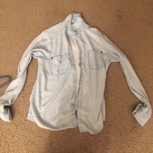Small female light blue button up shirt