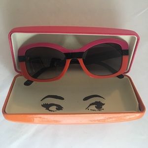 Prada pink/orange sunglasses.