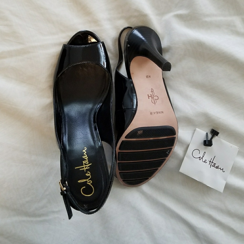 Cole Haan black patent leather sling backs.