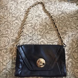 Black Elliot Luca clutch with shoulder strap